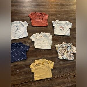 7 pack of Carter’s newborn short sleeve onesies